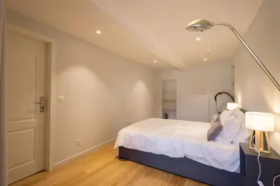 Ein Bett oder Betten in einem Zimmer der Unterkunft Visp Gem for 6