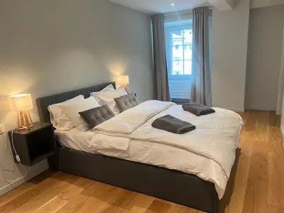Ein Bett oder Betten in einem Zimmer der Unterkunft Visp Gem for 6