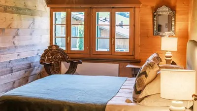 Ein Bett oder Betten in einem Zimmer der Unterkunft Chalet Ananda, Lauenen bei Gstaad