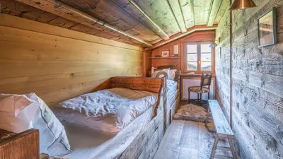 Ein Bett oder Betten in einem Zimmer der Unterkunft Chalet Ananda, Lauenen bei Gstaad