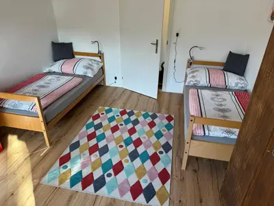Ein Bett oder Betten in einem Zimmer der Unterkunft See und Berge Family