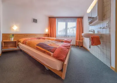 Ein Bett oder Betten in einem Zimmer der Unterkunft Bergrose