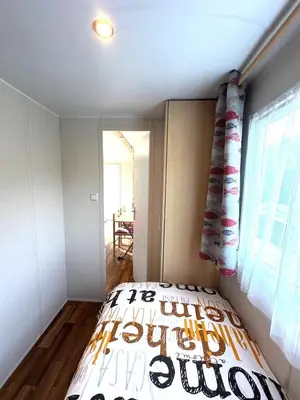 Ein Bett oder Betten in einem Zimmer der Unterkunft Cottage 4