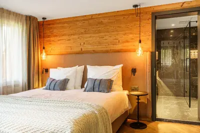 Ein Bett oder Betten in einem Zimmer der Unterkunft Boutique Hotel Panorama Grindelwald