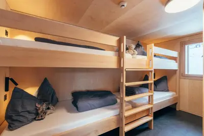 Ein Bett oder Betten in einem Zimmer der Unterkunft Giw Panorama Lodge 2000m