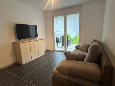 TV/Unterhaltungsangebot in der Unterkunft Gemütliche Wohnung mit Bergblick