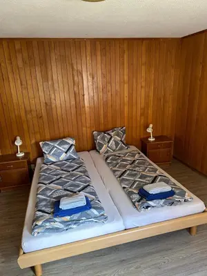 Ein Bett oder Betten in einem Zimmer der Unterkunft Wetterhorn