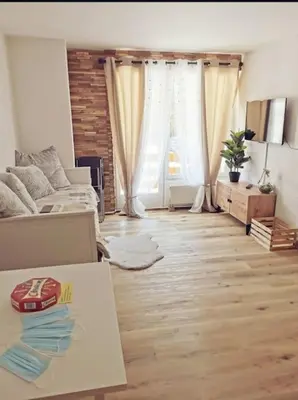 Ein Sitzbereich in der Unterkunft Charmant appartement balcon et parking