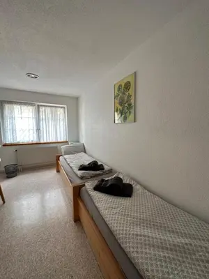 Ein Bett oder Betten in einem Zimmer der Unterkunft Touristenheim Bergfreude