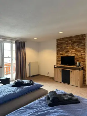 Ein Bett oder Betten in einem Zimmer der Unterkunft Touristenheim Bergfreude