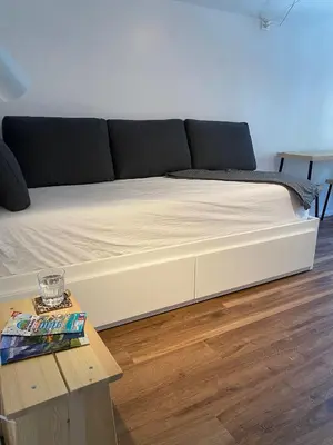 Ein Bett oder Betten in einem Zimmer der Unterkunft Chalet Studio Apartment with Aircon
