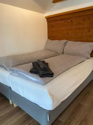 Ein Bett oder Betten in einem Zimmer der Unterkunft Chalet Studio Apartment with Aircon