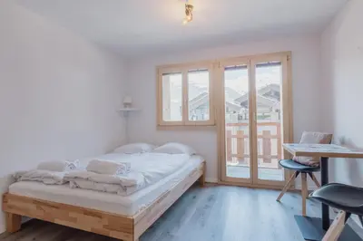 Ein Bett oder Betten in einem Zimmer der Unterkunft Chaleureux studio rénové à Grimentz