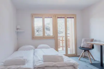 Ein Bett oder Betten in einem Zimmer der Unterkunft Chaleureux studio rénové à Grimentz