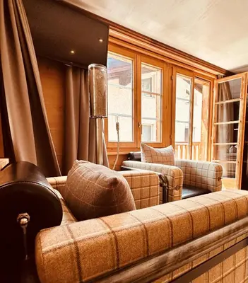 Ein Sitzbereich in der Unterkunft Self Check-In Chalet Rooms