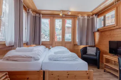 Ein Bett oder Betten in einem Zimmer der Unterkunft Studio dans le plus beau village de Suisse