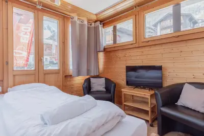 Ein Bett oder Betten in einem Zimmer der Unterkunft Studio dans le plus beau village de Suisse