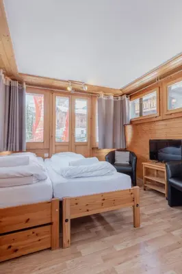 Ein Bett oder Betten in einem Zimmer der Unterkunft Studio dans le plus beau village de Suisse