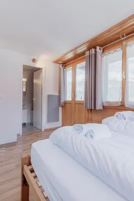Ein Bett oder Betten in einem Zimmer der Unterkunft Studio dans le plus beau village de Suisse