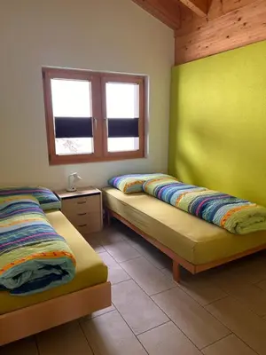 Ein Bett oder Betten in einem Zimmer der Unterkunft Chalet Adler Bettmeralp