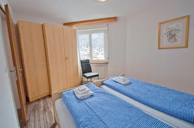 Ein Bett oder Betten in einem Zimmer der Unterkunft Haus Bodmen C, Apartment Anemone