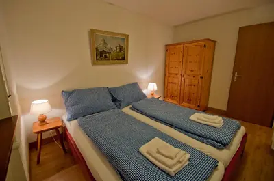 Ein Bett oder Betten in einem Zimmer der Unterkunft Haus Bodmen C, Apartment Grünsee