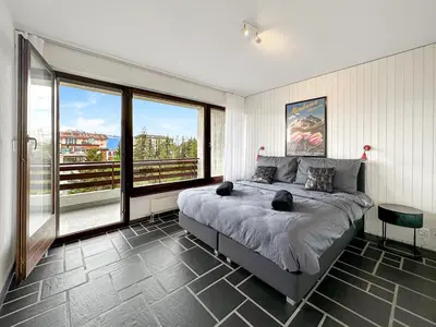 Ein Bett oder Betten in einem Zimmer der Unterkunft Instant Ski and Golf Paradise - Crans Montana