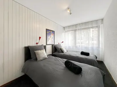 Ein Bett oder Betten in einem Zimmer der Unterkunft Instant Ski and Golf Paradise - Crans Montana