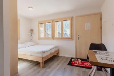 Ein Bett oder Betten in einem Zimmer der Unterkunft Studio à 2 minutes des remontées mécaniques