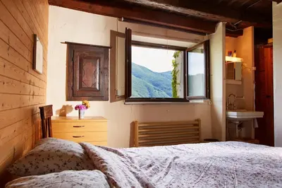 Ein Bett oder Betten in einem Zimmer der Unterkunft Wild Valley Rustico Esclusivo in Valle Onsernone