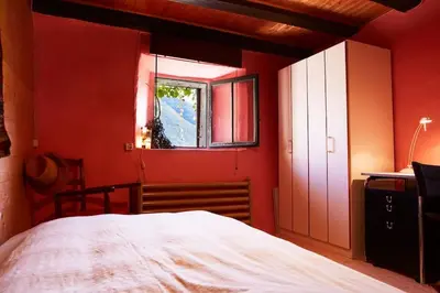 Ein Bett oder Betten in einem Zimmer der Unterkunft Wild Valley Rustico Esclusivo in Valle Onsernone