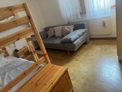 Ein Bett oder Betten in einem Zimmer der Unterkunft Appartement avec grande terrasse Loèche les Bains
