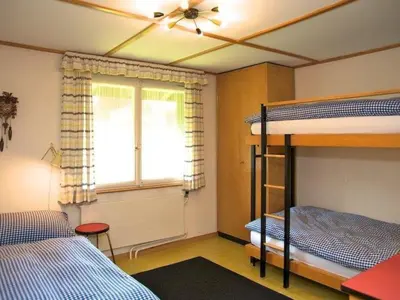 Ein Bett oder Betten in einem Zimmer der Unterkunft Apartment Pony 5-Bettwohnung by Interhome