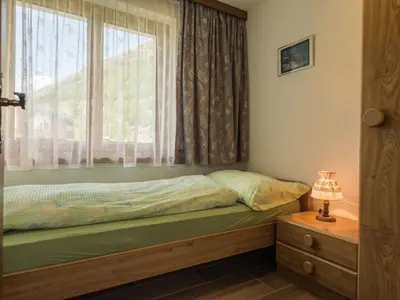 Ein Bett oder Betten in einem Zimmer der Unterkunft Apartment Haus Adora by Interhome