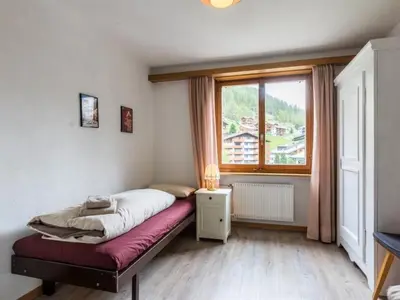 Ein Bett oder Betten in einem Zimmer der Unterkunft Apartment Cresta by Interhome