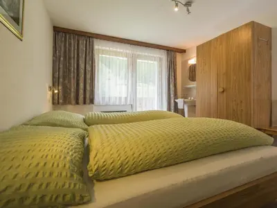 Ein Bett oder Betten in einem Zimmer der Unterkunft Apartment Haus Adora by Interhome