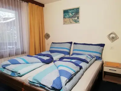 Ein Bett oder Betten in einem Zimmer der Unterkunft Apartment Floralpina by Interhome
