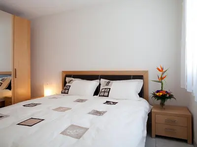 Ein Bett oder Betten in einem Zimmer der Unterkunft Apartment A22 by Interhome