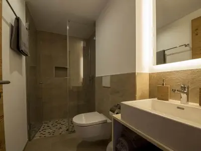 Ein Badezimmer in der Unterkunft Apartment Huwetz EG Süd by Interhome
