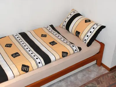 Ein Bett oder Betten in einem Zimmer der Unterkunft Apartment Strecce 2 by Interhome