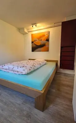 Ein Bett oder Betten in einem Zimmer der Unterkunft Ferienwohnung GreenLook - Ferien am Lungernsee