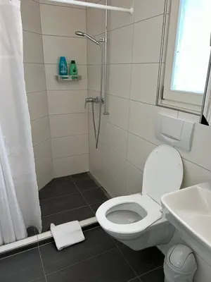 Ein Badezimmer in der Unterkunft Apartment TOM