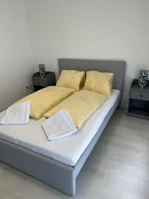 Ein Bett oder Betten in einem Zimmer der Unterkunft Apartment TOM