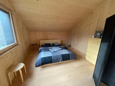 Ein Bett oder Betten in einem Zimmer der Unterkunft Modernes Ferienchalet