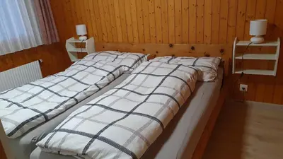 Ein Bett oder Betten in einem Zimmer der Unterkunft Chalet Falk