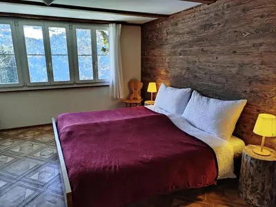 Ein Bett oder Betten in einem Zimmer der Unterkunft Sonnenhof - Wengens Original Kurhaus