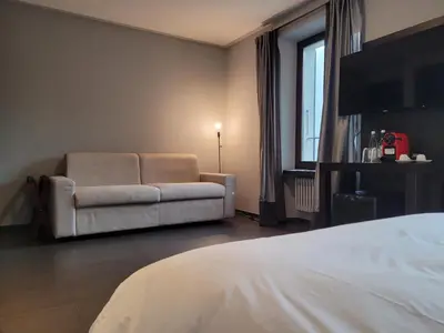 Ein Bett oder Betten in einem Zimmer der Unterkunft Ristorante Tentazioni