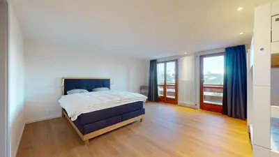 Ein Bett oder Betten in einem Zimmer der Unterkunft Chalet de l Ours VUE & NATURE Appart Pregny 8 pers