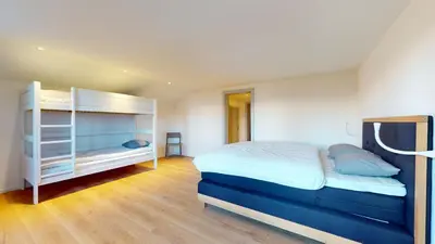 Ein Bett oder Betten in einem Zimmer der Unterkunft Chalet de l Ours VUE & NATURE Appart Pregny 8 pers