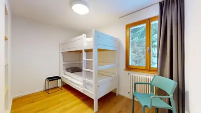 Ein Bett oder Betten in einem Zimmer der Unterkunft Chalet de l Ours AUTHENTIC Etage Tournay 12 pers